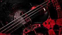 Guitar strings in red light